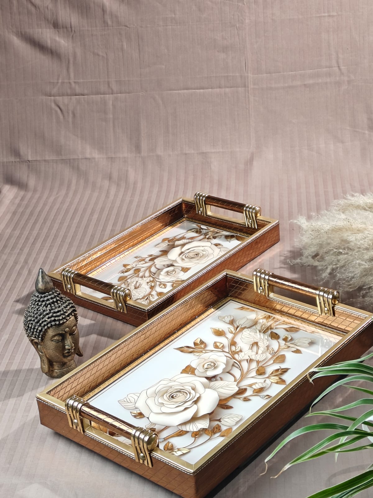Two Rectangle Leatherite Trays with floral designs on a neutral background