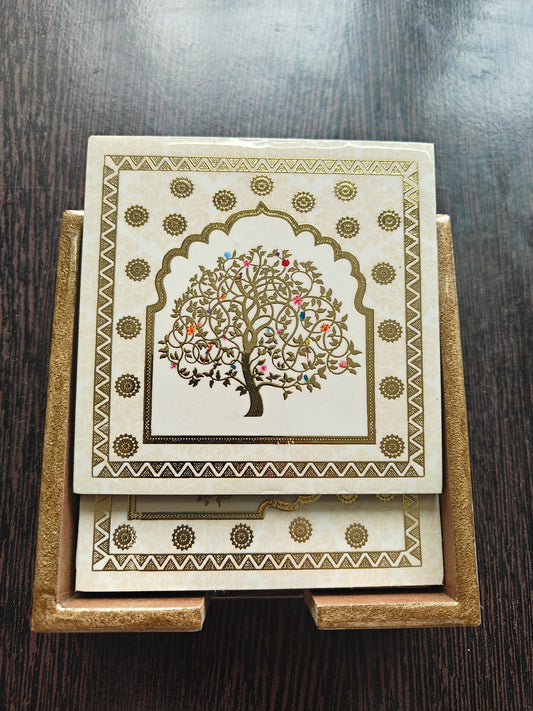 Decorative Wooden Coasters with tree design on a wooden stand