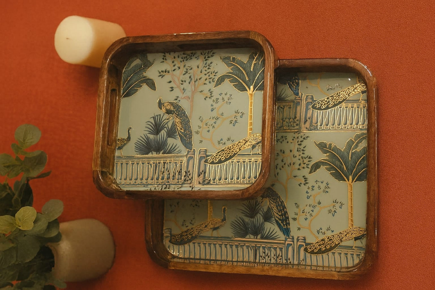Decorative trays with a tropical design on a red background